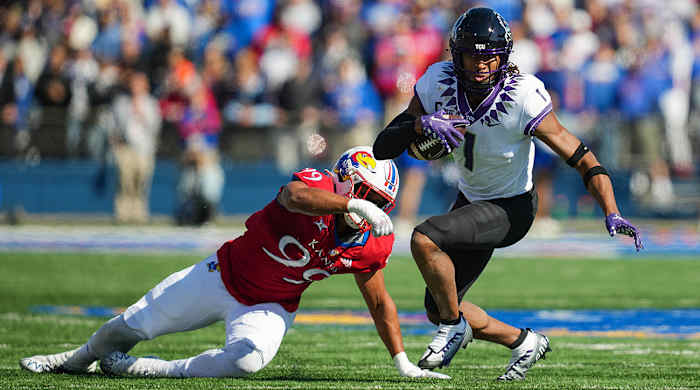 TCU WR Quentin Johnston runs after a catch against Kansas.